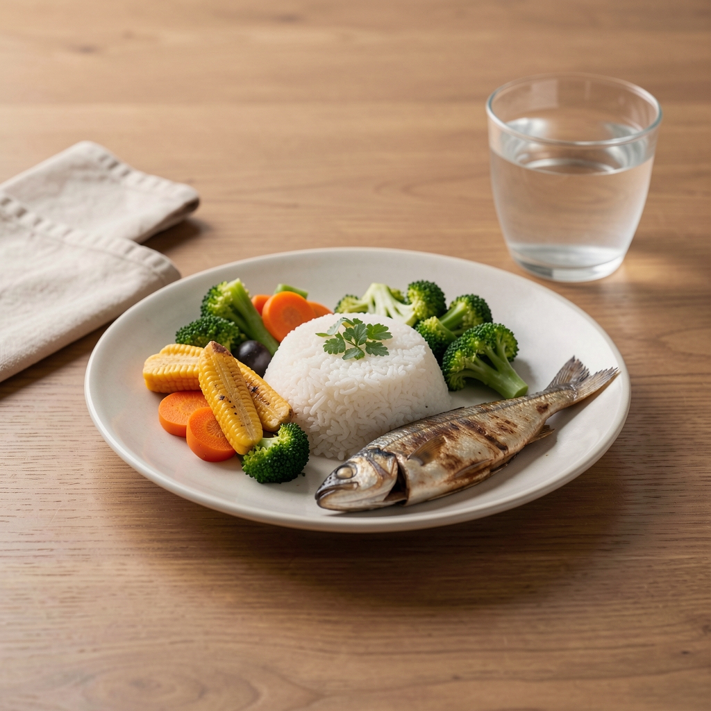Balanced Indonesian-inspired meal with rice, vegetables, fish and water on a simple table